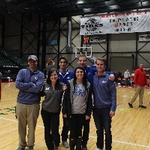 Six staff members on the basketball court for the Grand Rapids Drive